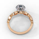Side profile view of a rose gold round brilliant cut diamond engagement ring highlighting the open under-gallery construction.