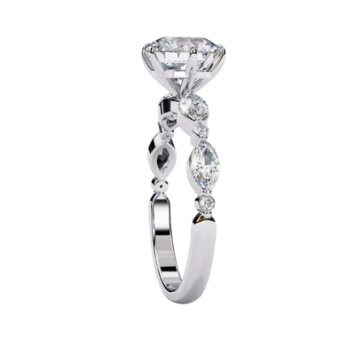 Side profile view of a white gold round brilliant cut diamond engagement ring showcasing an elegant cathedral gallery profile.