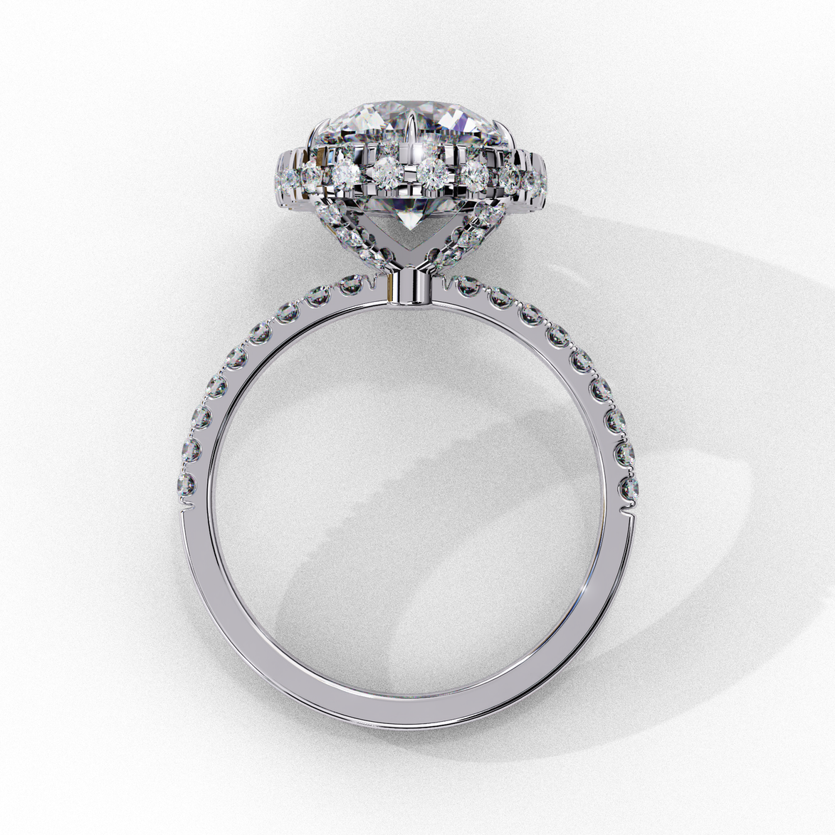 Top-down view of a white gold round brilliant diamond engagement ring with a striking double halo.
