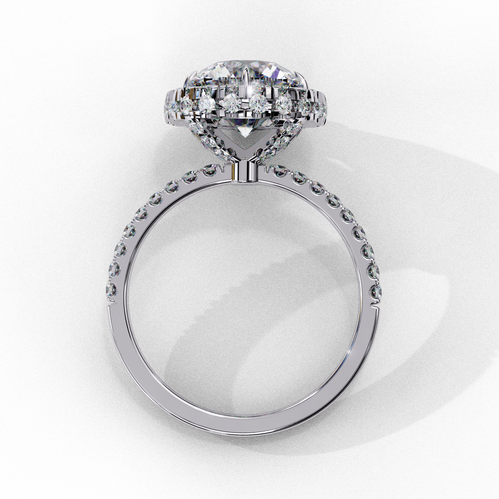 Top-down view of a white gold round brilliant diamond engagement ring with a striking double halo.
