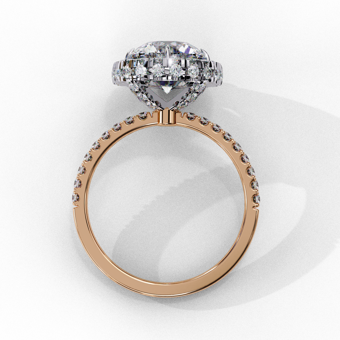 Top-down view of a rose gold round brilliant diamond engagement ring with a striking double halo.