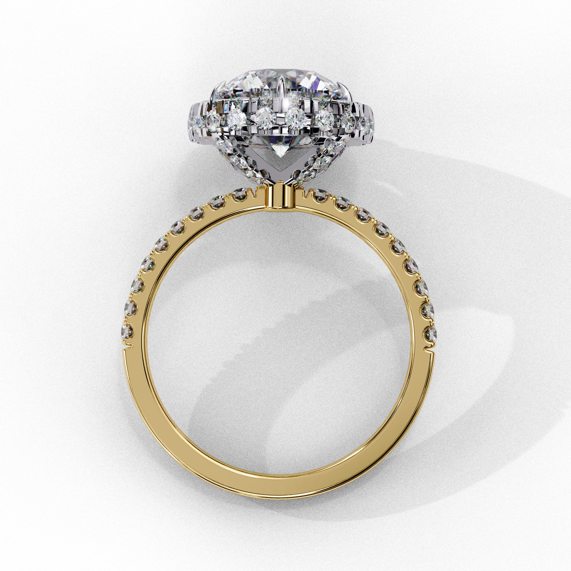 Top-down view of a yellow gold round brilliant diamond engagement ring with a striking double halo.