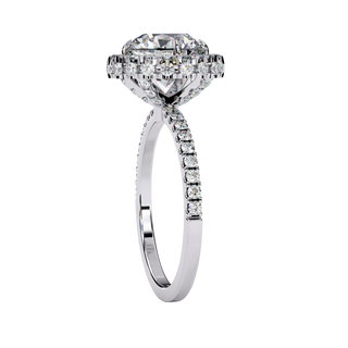Side profile view of a white gold round brilliant diamond double halo engagement ring with a cathedral setting.