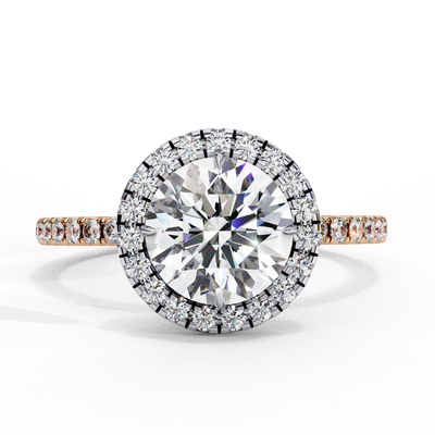 Top-down view of a rose gold round brilliant diamond engagement ring with a striking double halo.