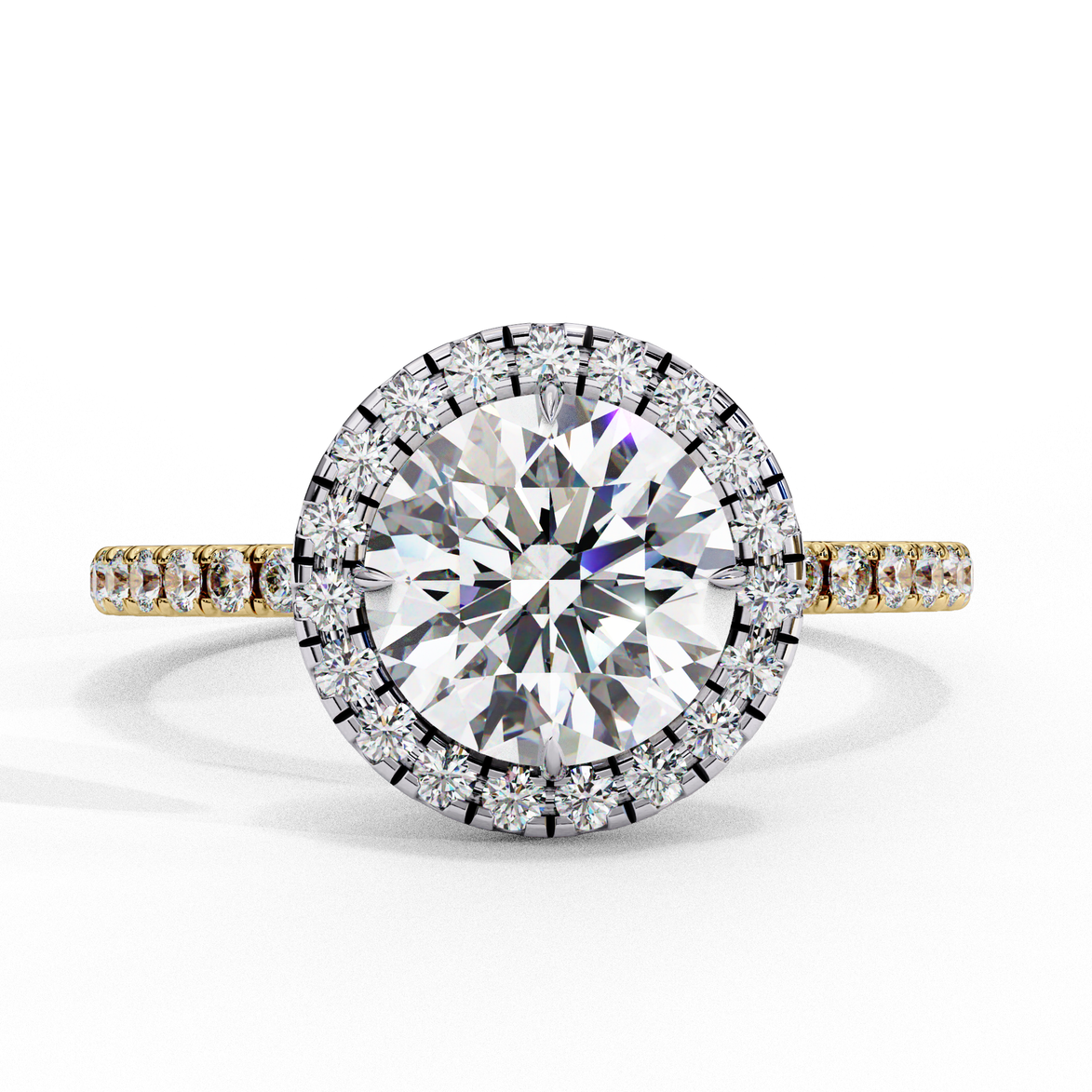 Top-down view of a yellow gold round brilliant diamond engagement ring with a striking double halo.