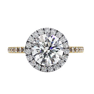 Top-down view of a yellow gold round brilliant diamond engagement ring with a striking double halo.
