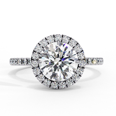 Top-down view of a white gold round brilliant diamond engagement ring with a striking double halo.