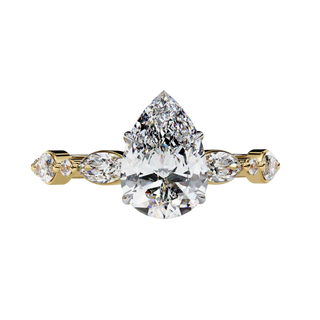 Yellow gold pear cut diamond ring, front view.