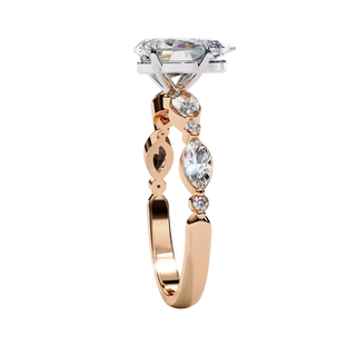 Side view of rose gold pear diamond ring.