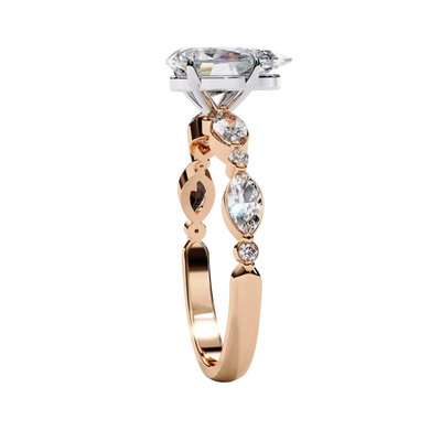 Side view of rose gold pear diamond ring.
