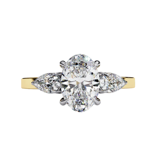 yellow gold oval cut diamond ring with pear side stones, front view.