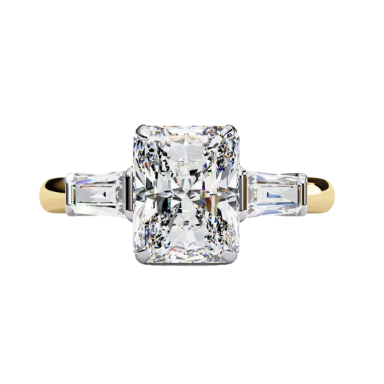 Yellow gold radiant cut diamond ring with tapered baguette side stones, front view.