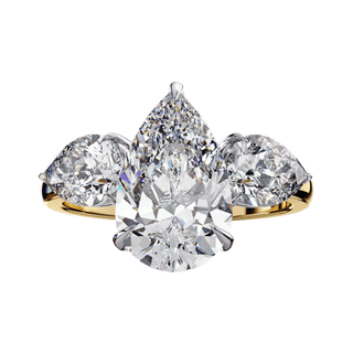 Front-facing view of a yellow gold pear-cut diamond three-stone ring.
