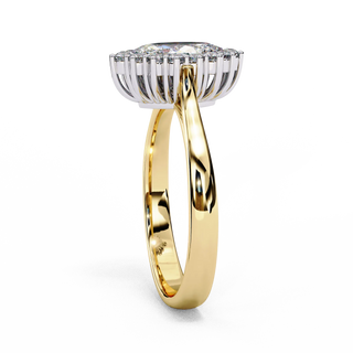 Side profile view of a yellow gold vintage marquise halo diamond ring.