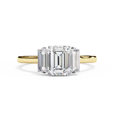 Front-facing view of a yellow gold emerald cut three stone diamond engagement ring.