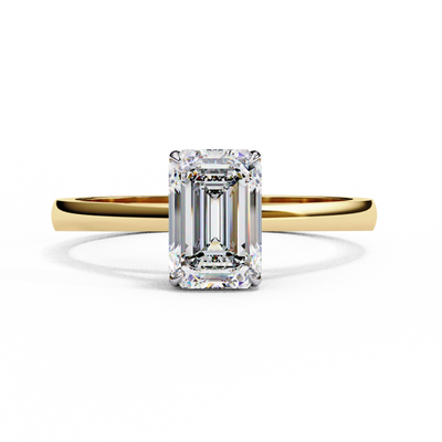 Front-facing view of a yellow gold emerald cut cathedral solitaire ring.