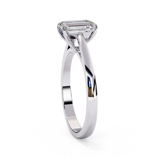 Side profile view of a white gold emerald cut cathedral solitaire ring.