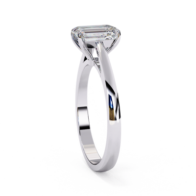 Side profile view of a white gold emerald cut cathedral solitaire ring.