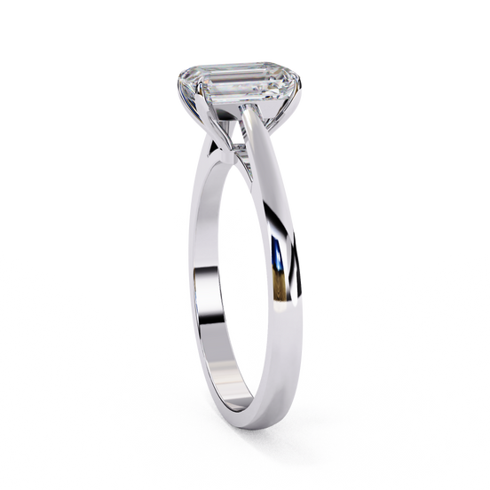 Side profile view of a white gold emerald cut cathedral solitaire ring.