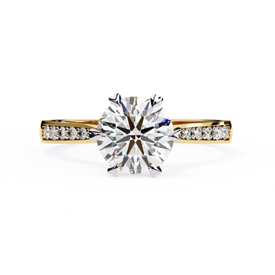 Front-facing view of a yellow gold round diamond pavé engagement ring.