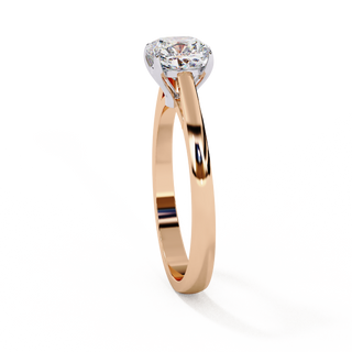 Side profile view of a rose gold cushion cut cathedral solitaire ring.