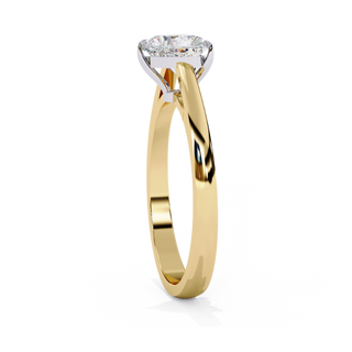 Side profile view of a yellow gold heart cut diamond cathedral solitaire engagement ring.