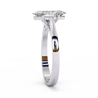 Side profile view of a white gold marquise cut diamond cathedral solitaire ring.