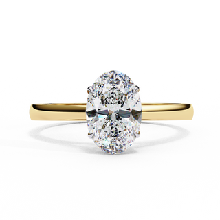 Front-facing view of a yellow gold oval diamond ring with elevated gallery.