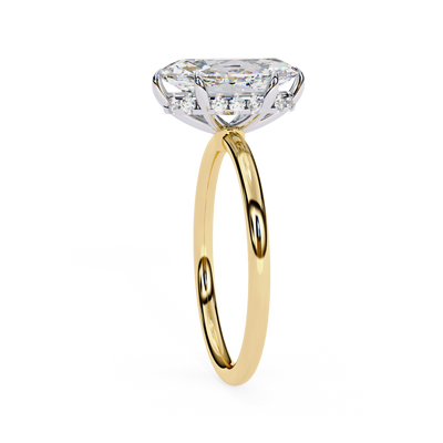 Side profile view of a yellow gold marquise diamond cathedral solitaire ring.