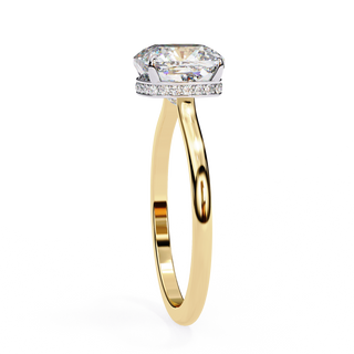 Side profile view of a yellow gold classic cushion cut hidden halo ring.
