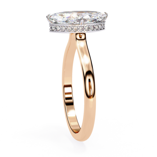 Side profile view of a rose gold marquise hidden halo diamond ring.