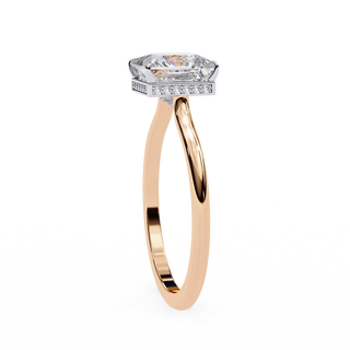 Side profile view of a rose gold princess hidden halo diamond ring.