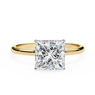 Front-facing view of a yellow gold princess hidden halo diamond ring.