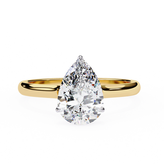 Front-facing view of a yellow gold pear hidden halo diamond ring.