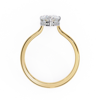 Top-down view of a yellow gold pear hidden halo diamond ring.