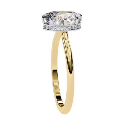 Side profile view of a yellow gold oval hidden halo diamond ring.