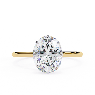 Front-facing view of a yellow gold oval hidden halo diamond ring.