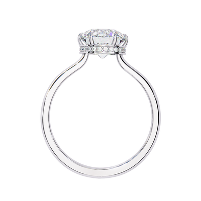 Side profile view of a white gold round hidden halo diamond ring.