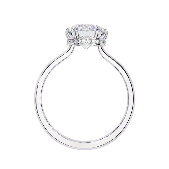 Side profile view of a white gold round hidden halo diamond ring.