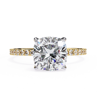 yellow gold ring with a large diamond and smaller diamonds on the band against a white background