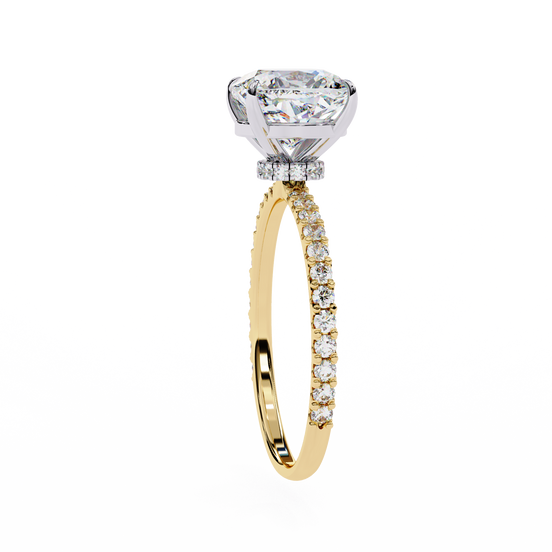 Gold ring with a large diamond and smaller diamonds on the band against a white background