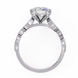 Diamond ring with a white gold band on a white background