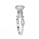 Silver ring with diamond accents on a white background