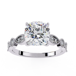 Diamond ring with a large central gemstone and smaller stones on a white background