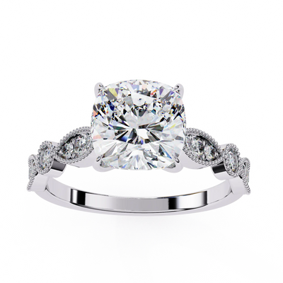 Diamond ring with a large central gemstone and smaller stones on a white background