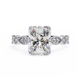 Diamond ring with a large central gemstone and smaller stones on a white background