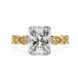Gold ring with a large diamond and smaller diamonds on the band against a white background
