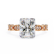 Diamond ring with rose gold band on a white background