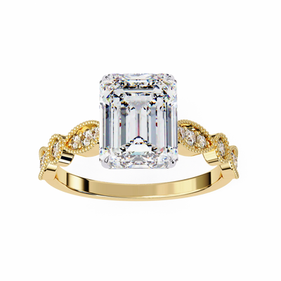 Gold ring with a large emerald-cut diamond and smaller diamonds on the band against a white background