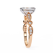 Rose gold ring with diamond accents on a white background